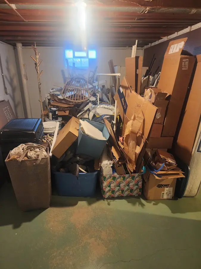 Roll-off dumpster container at job site for 20 Yard Dumpster Rental in Leland